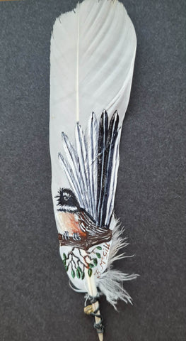 Beth McGill-Fantail on a branch with leaves